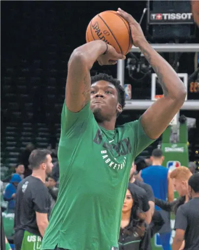  ?? CHRIS CHRISTO / BOSTON HERALD ?? GETTING HIS SHOT: Celtics rookie Robert Williams warms up before a recent game at the Garden. Williams made his NBA debut in Monday’s loss to the Magic.