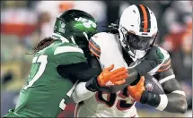  ?? Getty Images ?? NO NJOK’: Browns tight end David Njoku looks to shake off a tackle from Jets linebacker C.J. Mosley.