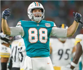  ?? JOHN MCCALL/SOUTH FLORIDA SUN SENTINEL ?? Dolphins tight end Mike Gesicki reacts after a catch against the Pittsburgh Steelers during the first half at Hard Rock Stadium on Oct. 23 in Miami Gardens.