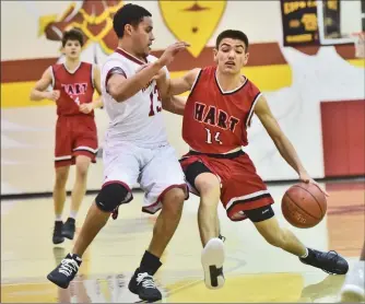  ?? Dan Watson/The Signal (See additional photos on signalscv.com) ?? Hart’s Joey Harand (14) drives against Alemany defender Jonathan Daniels (13) at Bishop Alemany High School on Friday in the Warrior Classic.