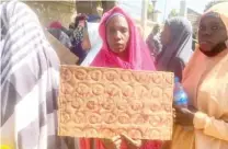  ?? ?? A mother of one of the abducted kids protesting in Kano