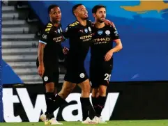  ?? (EPA) ?? City celebrate after Bernardo Silva, right, adds a fourth goal