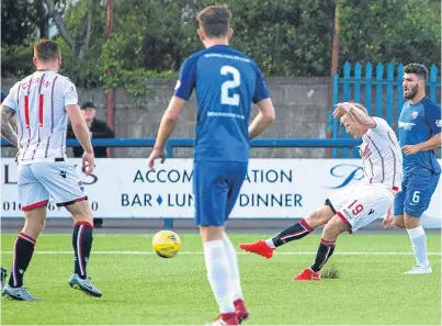  ?? Picture: SNS ?? Ross County’s Thomas Mikkelson, right, rifles home the fifth goal.
