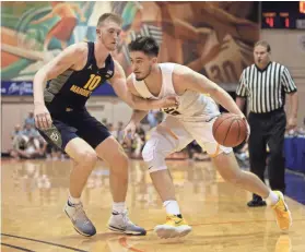  ?? ASSOCIATED PRESS ?? A key player because of his defensive versatilit­y, Sam Hauser guards Virginia Commonweal­th forward Sean Mobley recently.