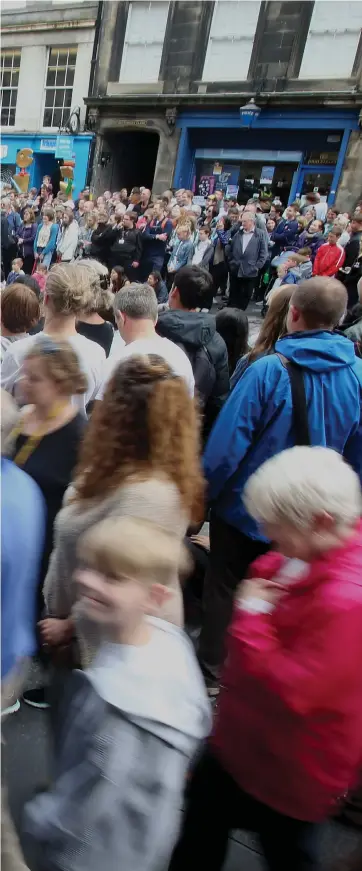  ??  ?? Kevin McKenna amid the crowds on the Royal Mile. ‘This is the time when old Edinburgh slips off its reserve and is possessed by something wild,’ he writes