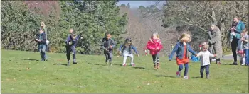  ??  ?? And they are off – children take part in the egg and spoon races.