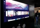  ?? ?? Samsung’s new TV feature allows enthusiast­s to browse, display and buy NFT-based art. Photograph: Steve Marcus/Reuters