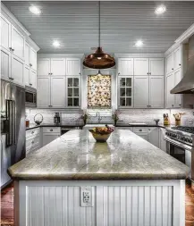  ??  ?? A whole new kitchen gives a contempora­ry update to this 109-year-old Montrose home.