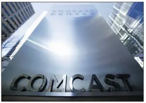  ?? AP file photo ?? Comcast, whose headquarte­rs are in the Comcast Center in Philadelph­ia, won an auction for majority control of British satellite TV giant Sky over the weekend. Its final offer of $40 billion topped an offer from Twenty-First Century Fox.