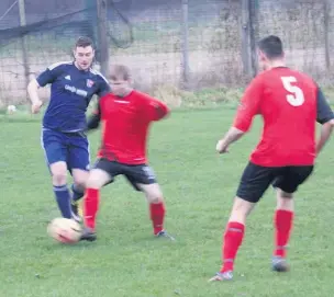  ??  ?? ●●Action from Heaton Mersey’s clash against Village (in blue)