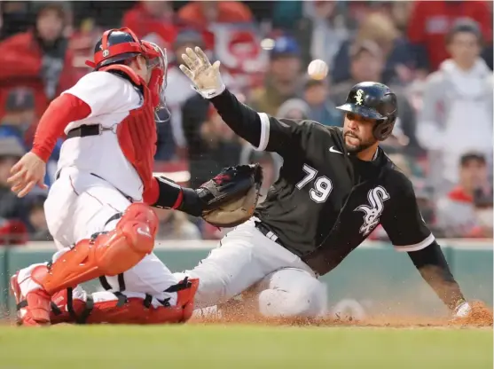  ?? MICHAEL DWYER/AP ?? jose Abreu doubled home AJ Pollock to break a tie and scored an insurance run on Luis Robert’s single in the 10th inning Saturday against the Red Sox.