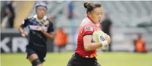 ??  ?? HONG KONG: In this Nov. 8, 2015, file photo, China’s Chen Keyi, right, runs with the ball to score a try during their match against Japan at the Asia Rugby Sevens Women qualifier in Hong Kong. The internatio­nal rugby federation is set to tackle the...