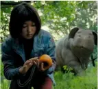  ??  ?? Top: Bright’s Will Smith as Daryl Ward with his orc partner Nick Jakoby (Joel Edgerton). Above: Mija (Ahn Seo-hyun) gathers food with her pig in Okja.