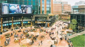  ??  ?? People gather in McGregor Square in Denver’s LoDo neighborho­od, Aug. 6.