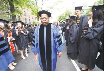  ?? Arnold Gold / Hearst Connecticu­t Media file photo ?? U.S. Rep. John Lewis walks in a procession on Elm Street in New Haven during a Yale University graduation ceremony in May 2017. Lewis received an honorary Doctor of Laws degree. Lewis, a civil rights icon and longtime member of Congress, died Friday.