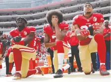  ?? MARCIO JOSE SANCHEZ/AP FILES ?? 49ers Eli Harold, left, Colin Kaepernick and Eric Reid kneel during the national anthem before a game back in October 2016. U.S. President Donald Trump isn’t a fan of such protests.