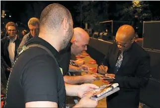 ??  ?? SUBMITTED PHOTOS Trombonist Greg Boyer signs autographs before performing with Maceo Parker in Antwerp, Belgium, in August 2016.