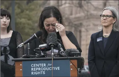  ?? SARA DIGGINS — AUSTIN AMERICAN-STATESMAN VIA AP ?? Anna Zargarian, one of five plaintiffs in Zurawski vs. State of Texas, speaks in front of the Texas State Capitol in Austin on Tuesday.