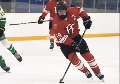  ?? Pete Paguaga / Hearst Connecticu­t Media ?? Fairfield Prep’s Mason Whitney skates with the puck against Notre Dame-West Haven on Wednesday at Bennett Rink in West Haven.