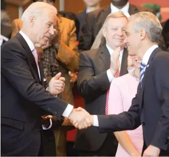  ?? SUN-TIMES FILES ?? Then-Mayor Rahm Emanuel shakes hands with then-Vice President Joe Biden after Emanuel’s inaugural address in May 2011 at Millennium Park.