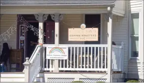  ?? H John Voorhees III / Hearst Connecticu­t Media ?? A post on the Molten Java Facebook page says that someone removed the Greenwood Avenue coffee shop’s pride flag on Saturday night, burned it, and placed it at their front door.