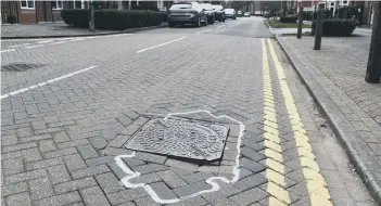  ??  ?? A manhole cover in Eagle Way.