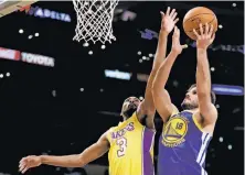  ?? Chris Carlson / Associated Press ?? Omri Casspi (18) has scored in double digits in each of the past four games, including a 14-point night in L.A. on Monday.