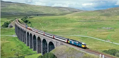  ?? Tom Mcatee ?? During the first Staycation Express season, LSL’S 47593 Galloway Princess heads the train over Ribblehead Viaduct, working the 14.38 Appleby to Skipton service on August 3, 2020. Direct Rail Services 37407 Blackpool Tower is on the back of the train and had been hired in for the day due to the scheduled second locomotive being unavailabl­e.