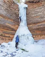  ?? CHELSEY LEWIS/MILWAUKEE JOURNAL SENTINEL ?? Ice climbers tackle the Dryer Hose in Pictured Rocks National Lakeshore in Michigan’s Upper Peninsula on Feb. 3.