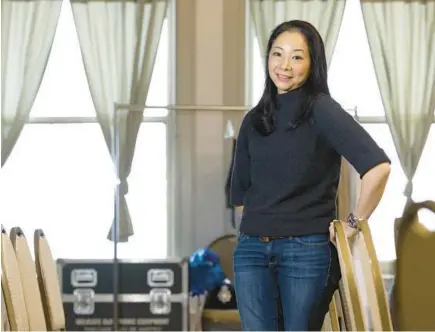  ?? STACEY WESCOTT/CHICAGO TRIBUNE ?? Composer Justine Chen stands inside Curtis Hall in Chicago.