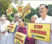  ?? ARVIND YADAV/HT PHOTO ?? Trinamool Congress MPS stage a protest holding banners against the incidents of mob lynching during the monsoon session at Parliament house in New Delhi on Tuesday.