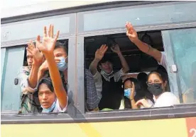  ?? Photo / AP ?? Freed demonstrat­ors are bussed from the Insein Prison in Yangon, Myanmar.