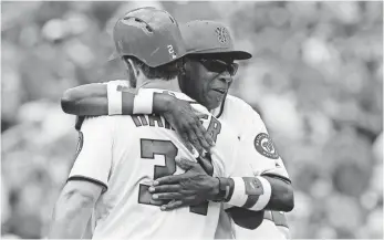  ?? GEOFF BURKE, USA TODAY SPORTS ?? Nationals manager Dusty Baker, right, first wore Mims Bandz when he played for the Athletics.