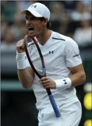  ?? ALASTAIR GRANT — THE ASSOCIATED PRESS ?? Andy Murray celebrates winning a point against Italy’s Fabio Fognini during their men’s singles match on Day 5 at Wimbledon.