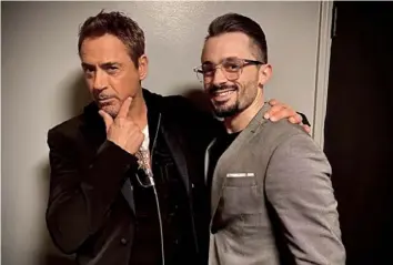  ??  ?? Brad Lambert, with Robert Downey Jr. in December 2019, joined the “Iron Man” actor’s team when he first moved out to Los Angeles to pursue his Hollywood dreams.