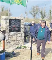  ?? ?? Michael Kenneally laying a wreath at the monument to commemorat­e the local Volunteers. Michael is son of Paddy Kenneally, Graigue and Ballyboy East, Clogheen. Paddy’s brother Jim was also honoured on the day.