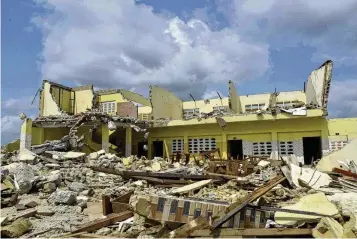  ?? DIOMANDE BLE BLONDE / AP ?? A house demolished on public health grounds in Abidjan, Ivory Coast is shown. Rapid urbanizati­on has led to a population boom and housing shortages in Abidjan, where nearly one in five Ivorians reside, many of them in lowincome, crowded communes like the ones in the Gesco and Sebroko districts being demolished on public health grounds.