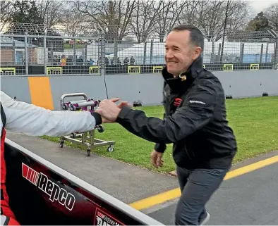  ?? ?? Above: Andre Heimgartne­r is congratula­ted by Greg Murphy after finishing second in the Supercars race yesterday. Will Davison, far left, celebrates winning.