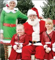  ?? TIMES file photograph ?? In 2019, Santa’s assistant Esther Cutberth, left, joined Santa as Kayla Trager, 6, and Paisley Hammers, 4, visited with Santa at the Wonderland Christmas Tree Farm Sunday, Dec. 8, 2019. Trager, daughter of Matt and Jennifer Trager, and Hammers, daughter of Josh and Becky Hammers, are all of Seligman, Mo.