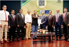  ??  ?? BOC CEO/ General Manager Senarath Bandara exchanging the signed MoU with Sri Lanka Mobitel CEO Nalin Perera. Officials representi­ng both parties are also in the picture.