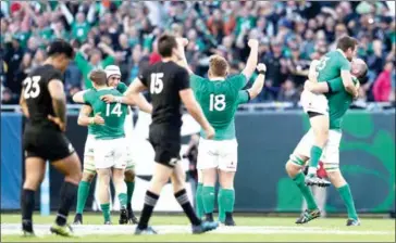  ?? PHIL WALTER/GETTY IMAGES/AFP ?? Ireland players celebrate their 40-29 victory over New Zealand at Soldier Field on Saturday in Chicago, Illinois.