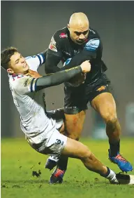  ??  ?? Staying upright: Exeter’s Olly Woodburn fights off the tackle of Callum Sheedy