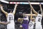  ?? SOOBUM IM/ USA TODAY ?? Los Angeles Clippers point guard Chris Paul (3) drives to the basket as San Antonio’s Boris Diaw (33), Tim Duncan (21) and Kawhi Leonard (2) defend Sunday in Game 4 of their playoff series.