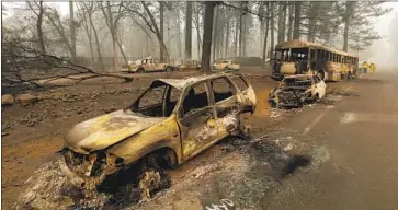  ?? Carolyn Cole Los Angeles Times ?? INCINERATE­D vehicles line a road. The Camp fire is already the most destructiv­e in California history, burning 6,453 homes and 260 commercial buildings. It is also destined to be among the deadliest.