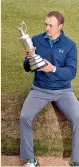  ??  ?? Jordan Spieth poses with the Claret Jug. — AFP