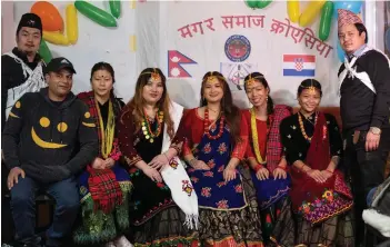  ?? Photos — AFP ?? Dhami Man Singh (second left), 43, owner of “Himalaya Curry Nepali”, and foreign workers from Nepal, dressed in local folk costumes, pose for a photo in Nepalese restaurant “Himalaya Curry Nepali”, in the centre of Zagreb, Croatia.