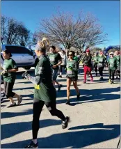  ?? CHRISTY DYRR — DURHAM SPORTS BOOSTERS ?? Runners head off from the starting line following the gun during the 41st annual Almond Blossom Run in Durham, on Sunday.