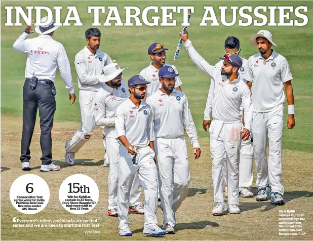  ?? AP ?? Virat Kohli raises a stump to acknowledg­e the applause from the crowd after India’s win over Bangladesh. —