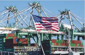  ?? (AFP) ?? Shipping containers are unloaded at the Long Beach Port in Los Angeles, US