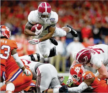  ?? GETTY IMAGES ?? Alabama running back Damien Harris (top) said the Crimson Tide are motivated because they don’t want to experience the feeling of disappoint­ment from last year’s loss in the championsh­ip game to Clemson.